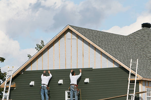 Professional Storm Damage Siding Repair technician working in Biscoe, NC